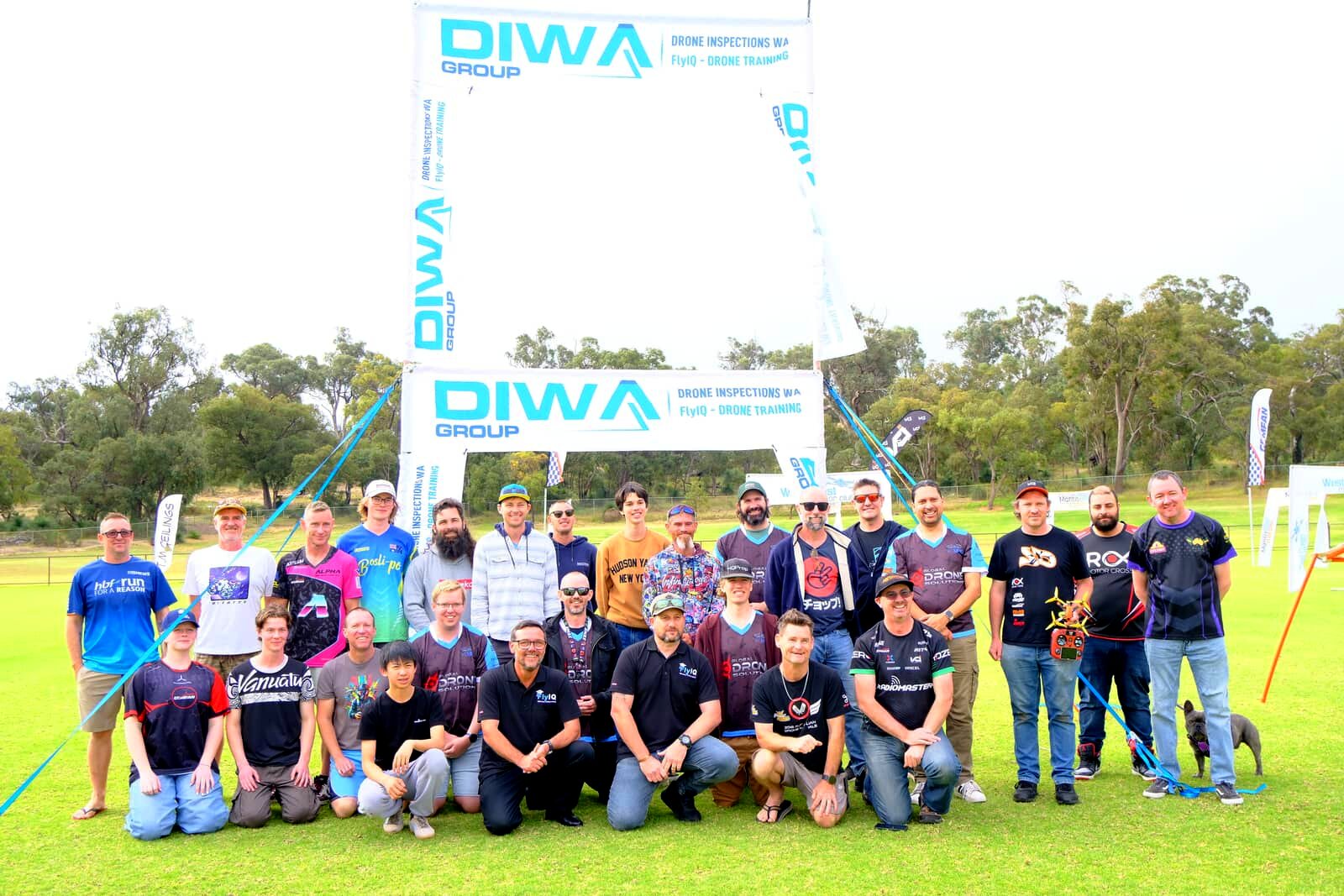 Pilots, crew and volunteers of the 2026 WA State Championships under the DIWA Group gate at Kwinana