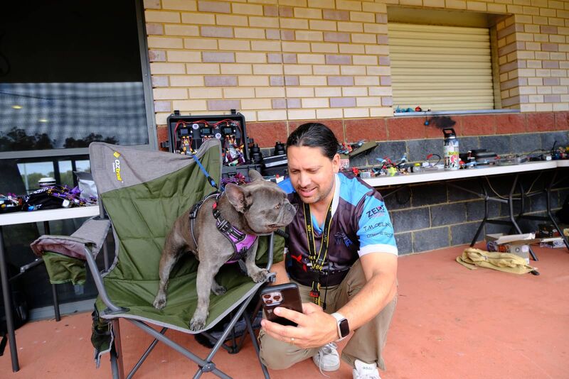 A pilot and their dog in the pits